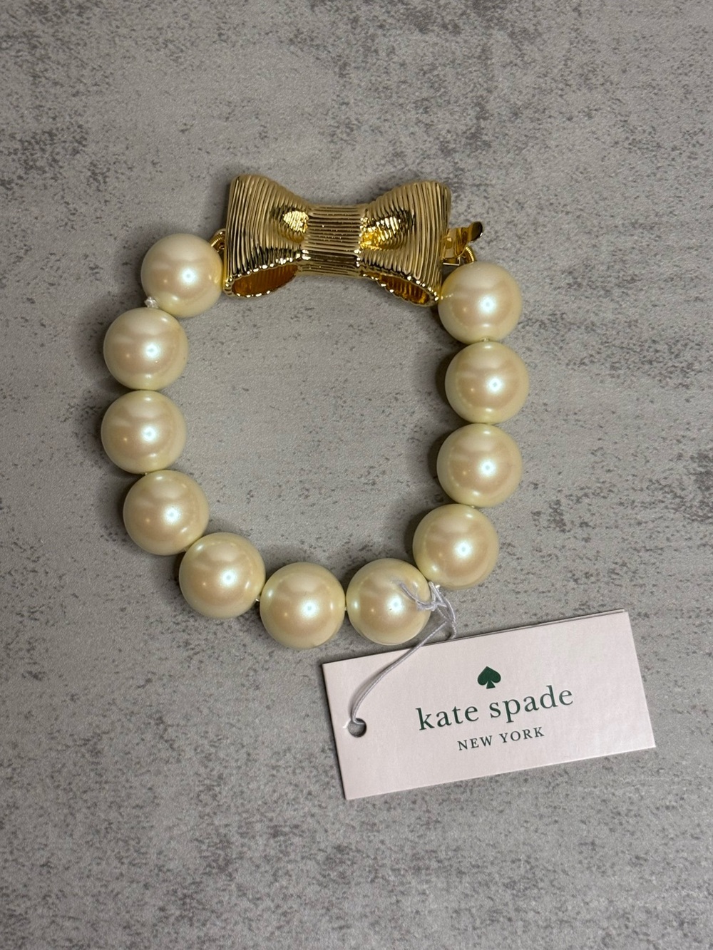 Kate Spade All Wrapped Up Faux Pearl Bracelet with Gold Bow Closure - Picture 2 of 10